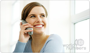 Smiling woman enjoying easy access to her World Numbers online dashboard using her mobile telephone device